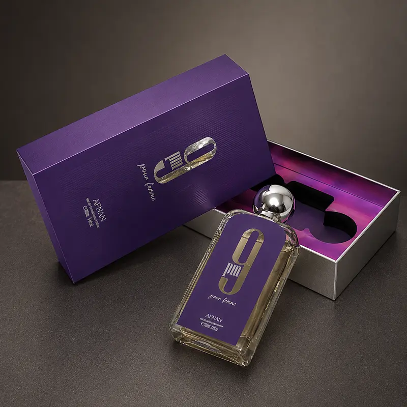 Complete luxury presentation of Afnan 9 PM Femme including bottle, inner tray, and outer box.