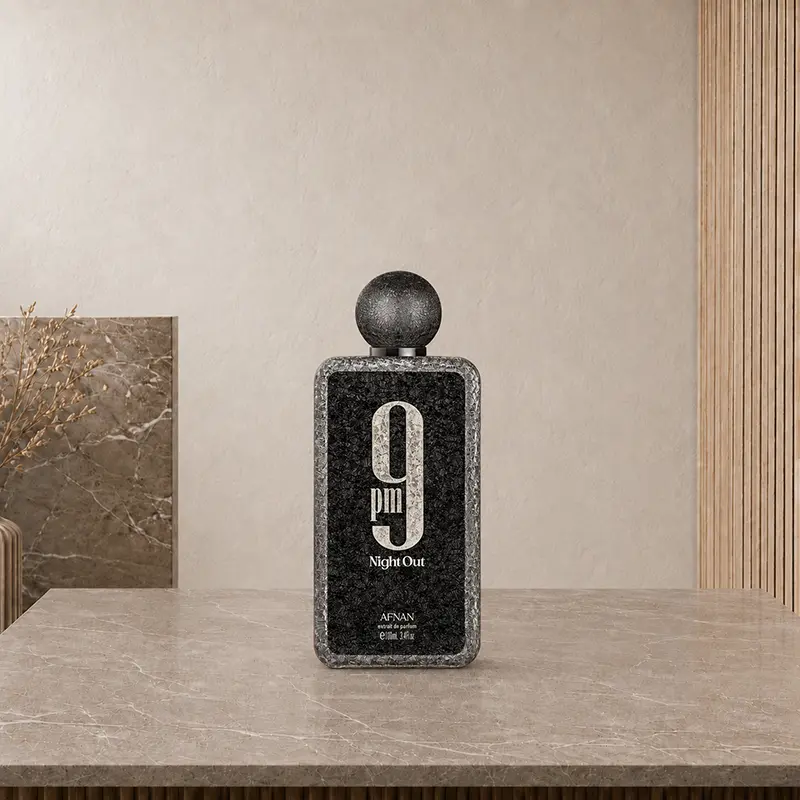 Centered Afnan 9PM Night Out Extrait de Parfum 100ml bottle photographed front-on in a neutral beige studio.