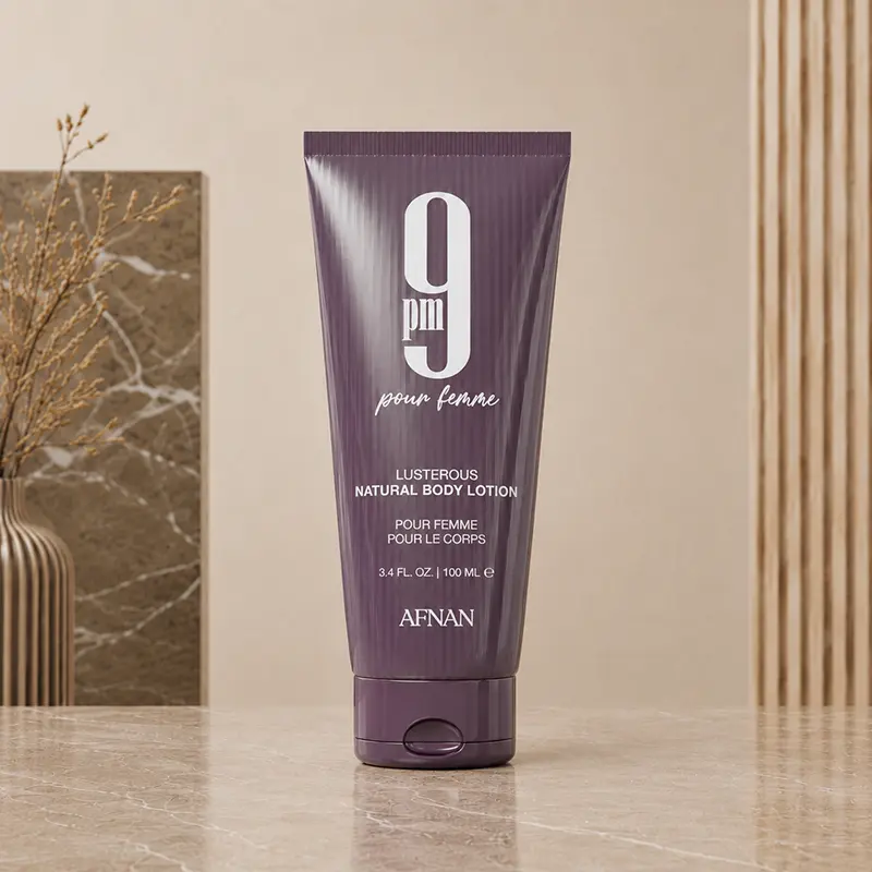 Purple 100 ml body lotion tube from the Afnan 9 PM Pour Femme gift set.