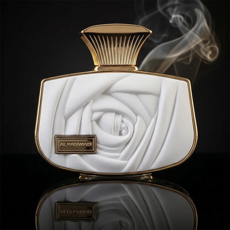 Front view of Al Haramain Belle women perfume bottle with unique white rose texture and gold cap.