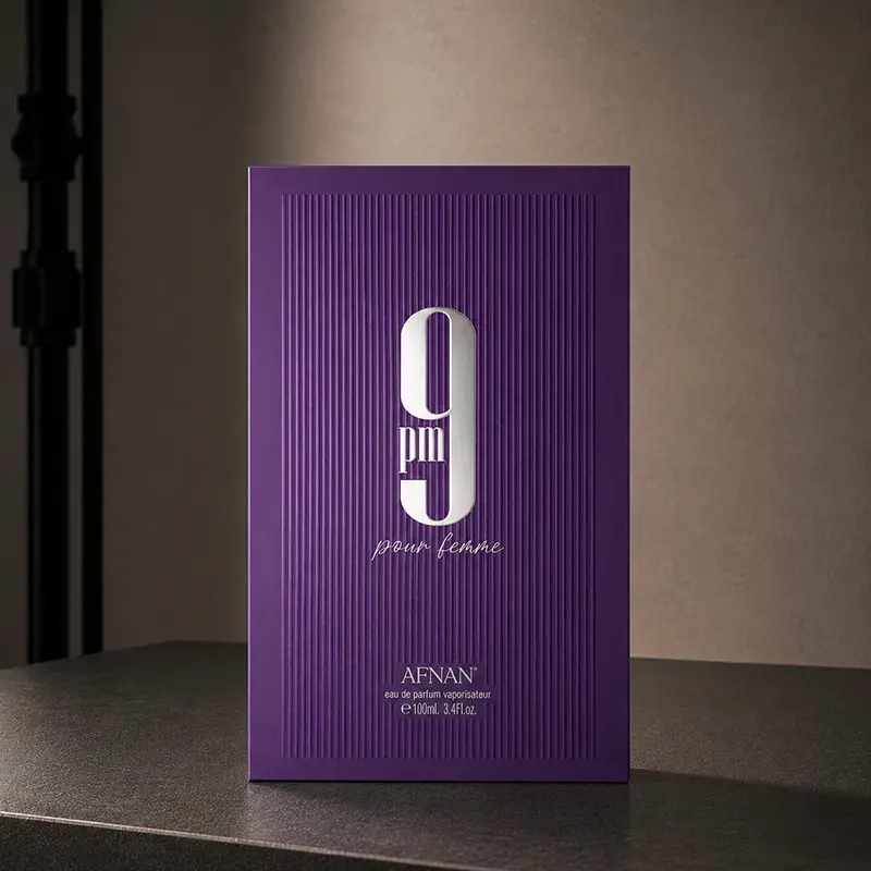 Detailed front packaging design of the Afnan 9 PM Pour Femme box with bold branding.