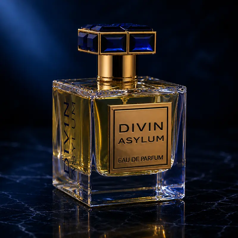 Detailed closeup of the Divin Asylum parfum bottle featuring blue crystal cap and luxury glass finish.