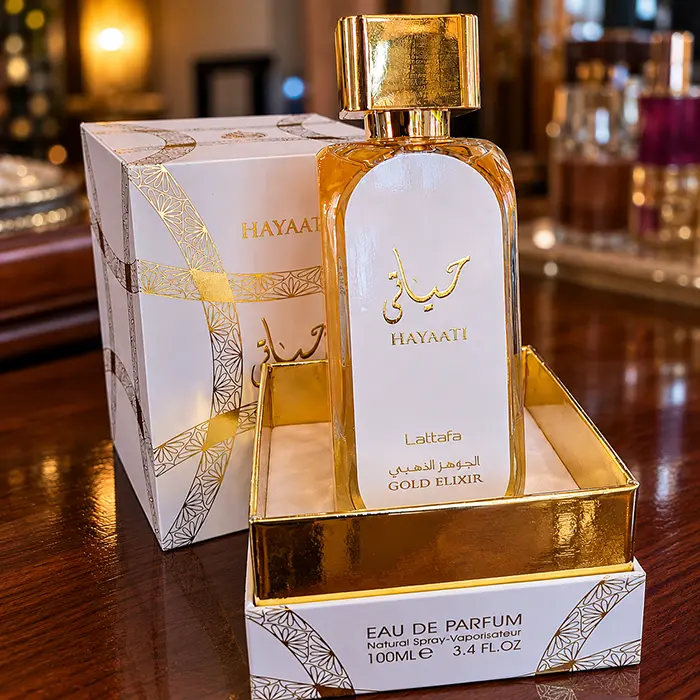 Warm fragrance setting featuring Lattafa Hayaati Gold Elixir placed on a sophisticated dressing table