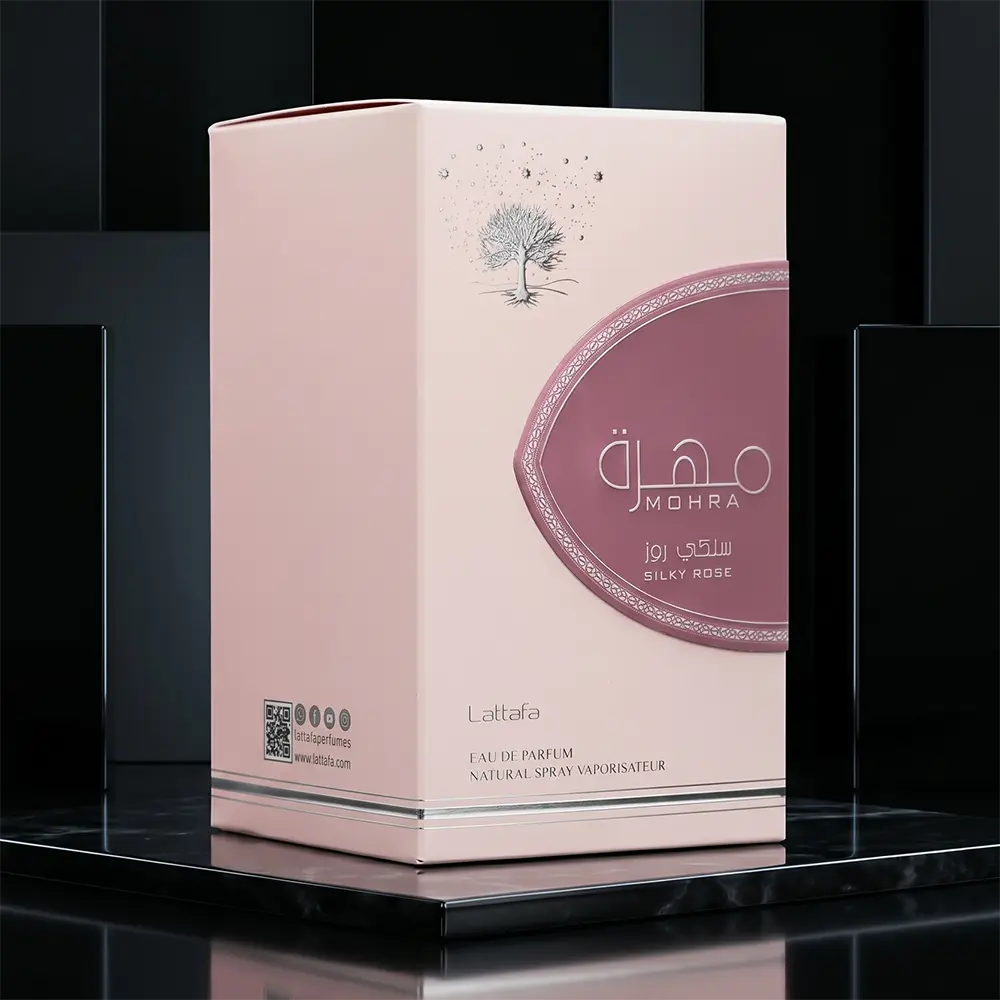 Detailed view of the embossed pink luxury packaging box for Lattafa Mohra Silky Rose fragrance.