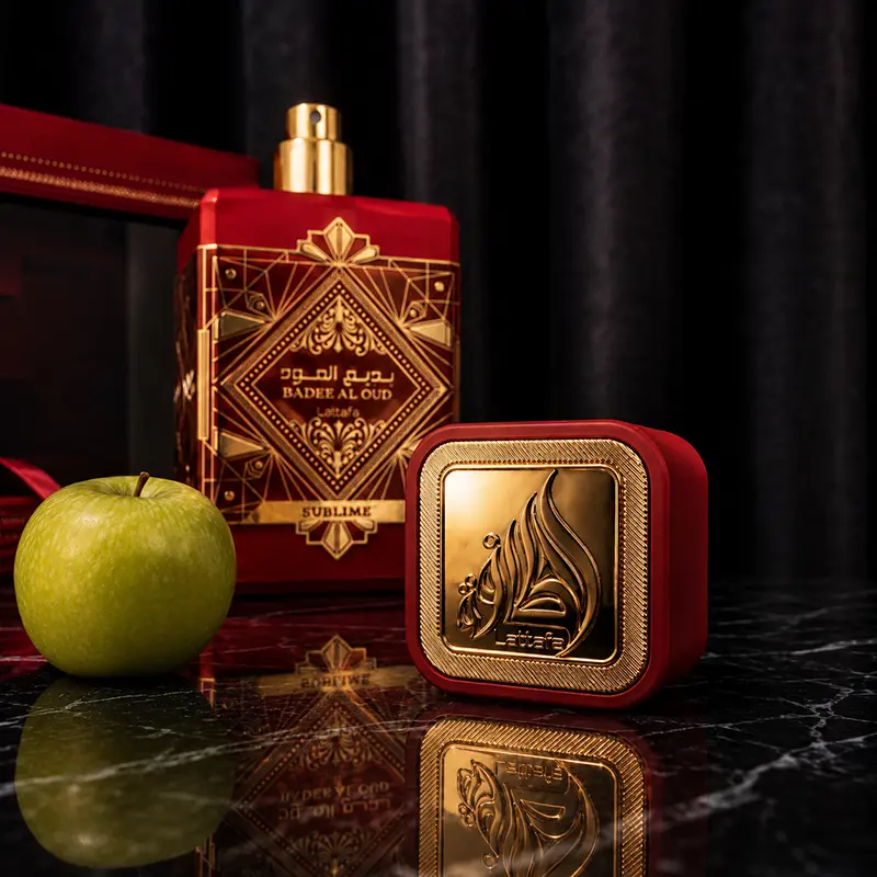 Close-up view of the shiny gold atomizer nozzle alongside the heavy textured red cap featuring the Lattafa insignia.