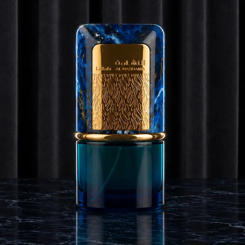 Macro closeup focusing on the blue marbled finish and intricate gold emblem of the Lattafa Caprice bottle.