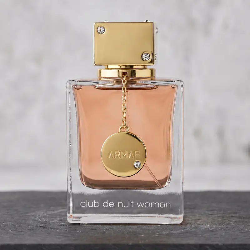 Exquisite golden-accent bottle of Armaf Club De Nuit Woman with modern European elegance.