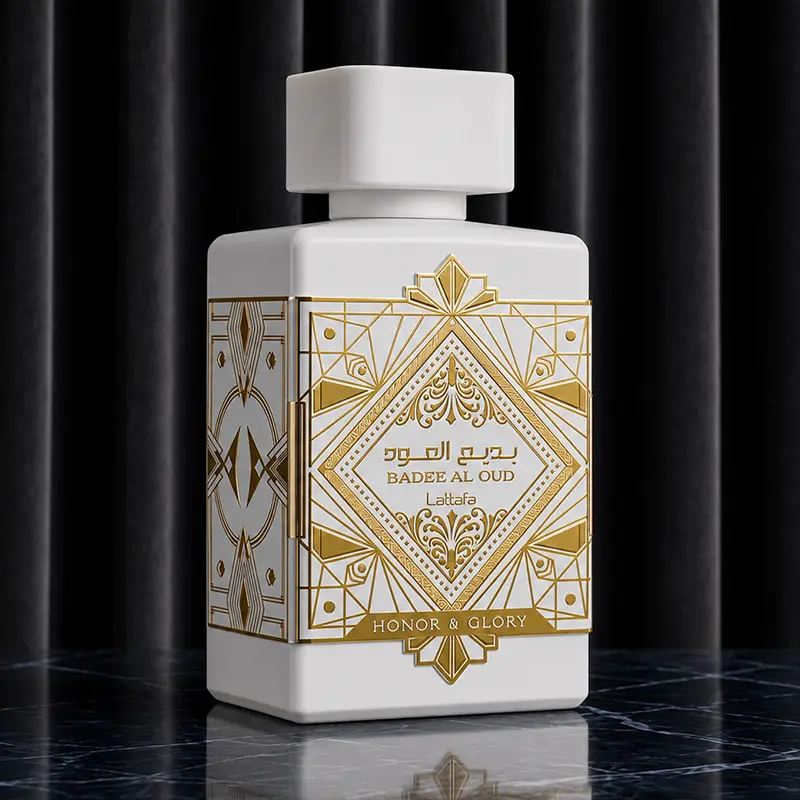 White opaque perfume bottle with intricate gold geometric filigree details against a dark pleated backdrop.