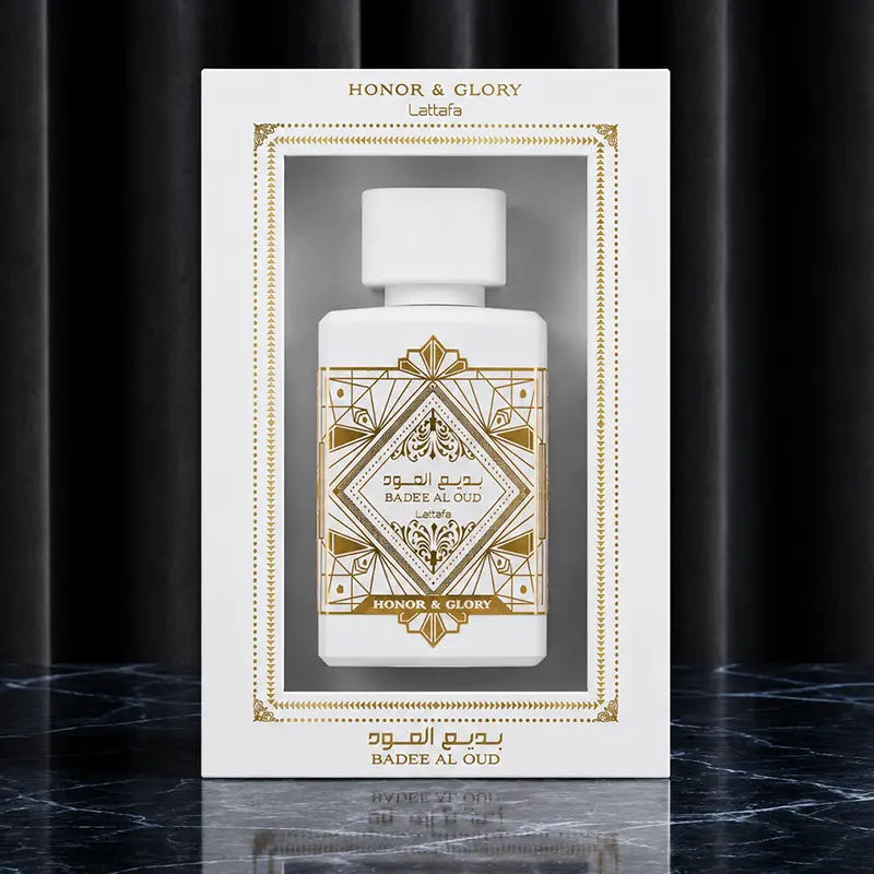 White and gold outer packaging box showcasing the nested unisex Eau de Parfum bottle inside.