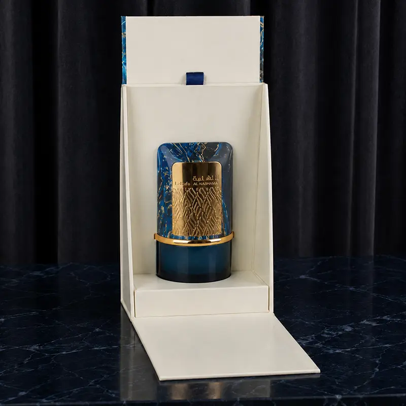 Open view of the Lattafa Al Nashama Caprice packaging revealing the beautifully crafted blue bottle.