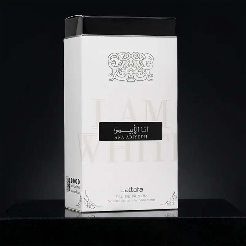 Angled view of the white and black Lattafa Ana Abiyedh perfume box highlighting the 'I Am White' embossed text.