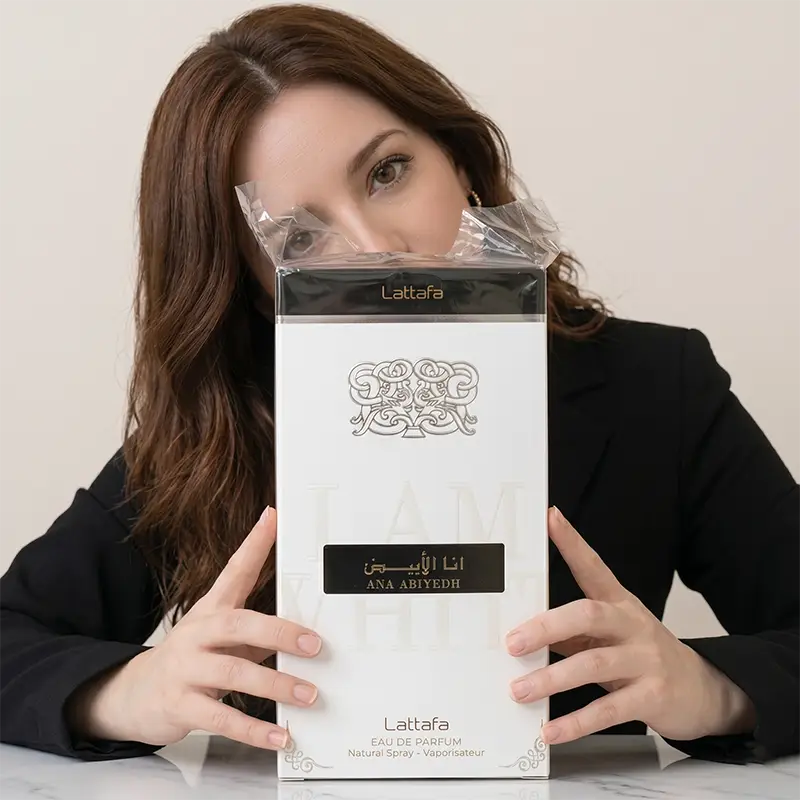 Front view of Lattafa Ana Abiyedh 60ml white box featuring the embossed brand logo and Arabic calligraphy.
