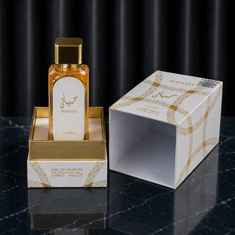 Interior packaging display showing Hayaati Gold Elixir bottle inside its decorative gold frame