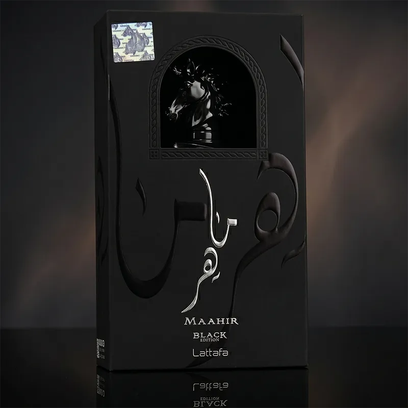 Lattafa Maahir Black Edition 100ml unisex perfume bottle with iconic horse head cap in a luxury black studio setting.