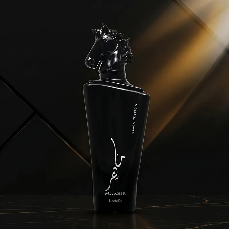 Authentic luxury packaging box of Maahir Black Edition by Lattafa, highlighting the silver calligraphy and horse emblem.