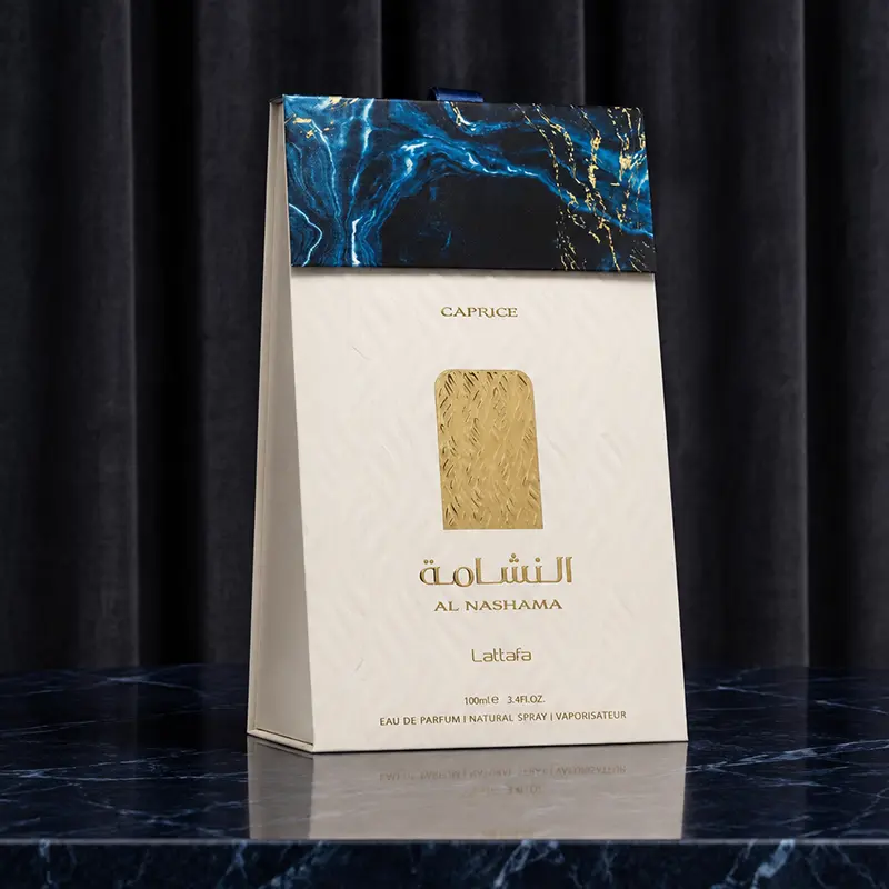 Angled perspective of the textured Lattafa Caprice box, clearly highlighting the embossed gold branding.