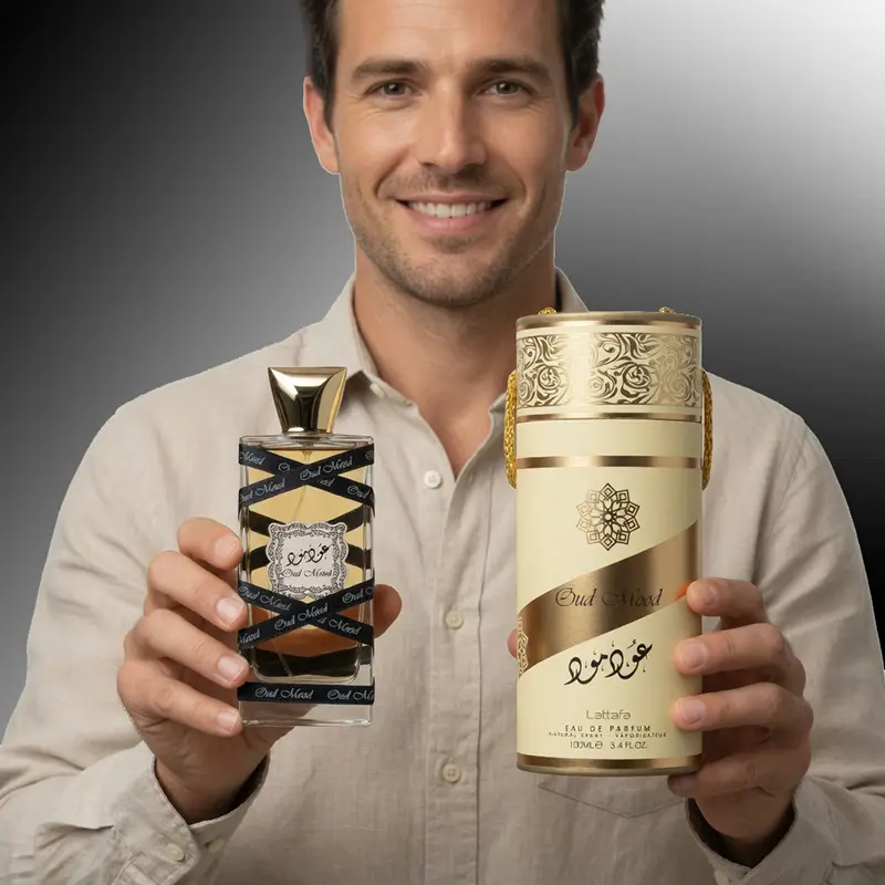 Male model presenting Lattafa Oud Mood unisex perfume bottle and original gold tube packaging set.