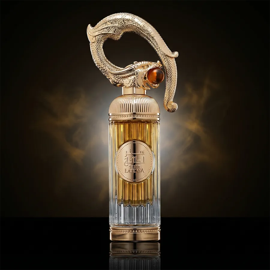 Authentic Lattafa Sehr unisex 100ml bottle with sculptural golden cap and long-lasting amber gourmand fragrance.