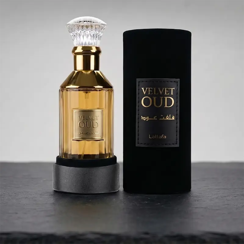 Closeup of the embossed Lattafa Velvet Oud luxury packaging and golden parfum bottle detailing.