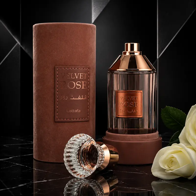 Macro closeup showing the crystal cap and open luxury suede packaging of Lattafa Velvet Rose with a white rose.