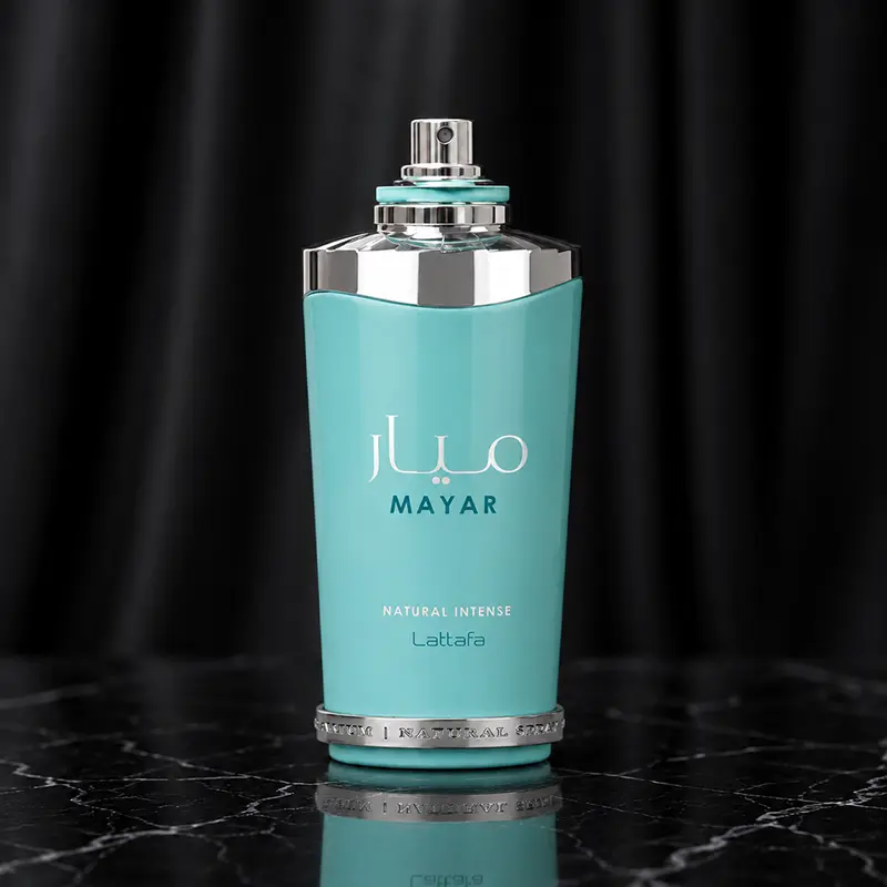 Turquoise perfume bottle with the cap removed to reveal the silver spray nozzle