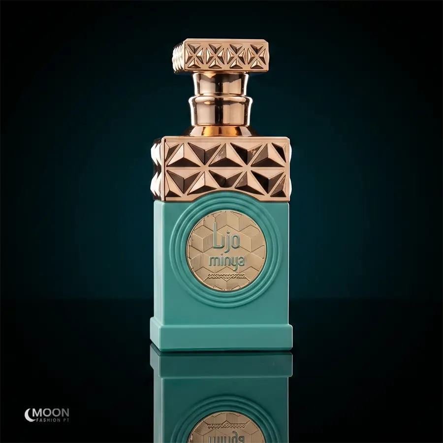 Elegant teal and gold 100ml glass bottle of Minya Eau De Parfum, a luxury unisex gourmand scent.
