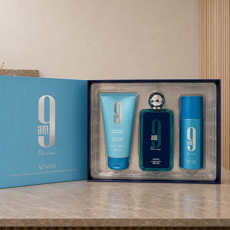 Opened Afnan 9AM Dive presentation box revealing the shower gel, perfume and deodorant spray.