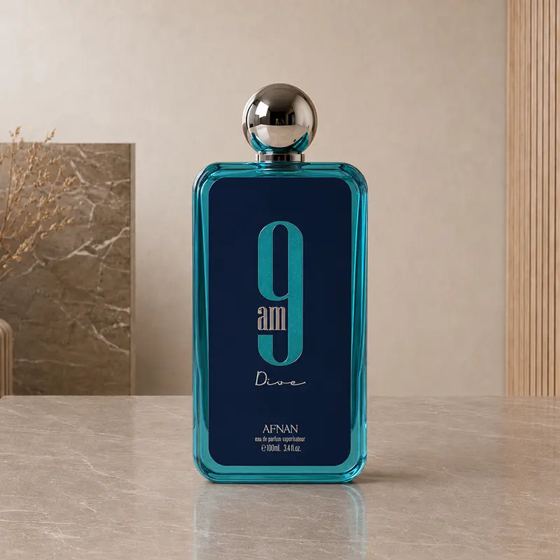 Turquoise glass Afnan 9AM Dive Eau de Parfum 100 ml bottle with a silver spherical cap.